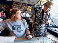 Station manager, Jennifer Mulcare-Sullivan takes a final well-wishing call as DJ Ed Slota prepares to spin a final song before the staion transitions to online only.  The University of Massachusetts Dartmouth radio station, WUMD, stopped broadcasting over the airwaves after 42 continuous years.   It will now continue to broadcast strictly over the internet at www.umd.rocks   [ PETER PEREIRA/THE STANDARD-TIMES/SCMG ]